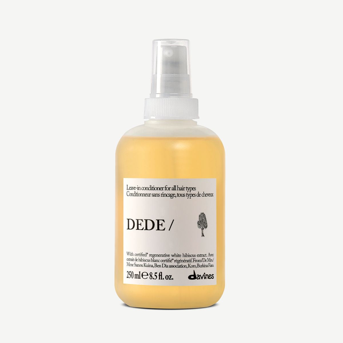 Bottle of Dede leave in conditioner spray hair product on a white background