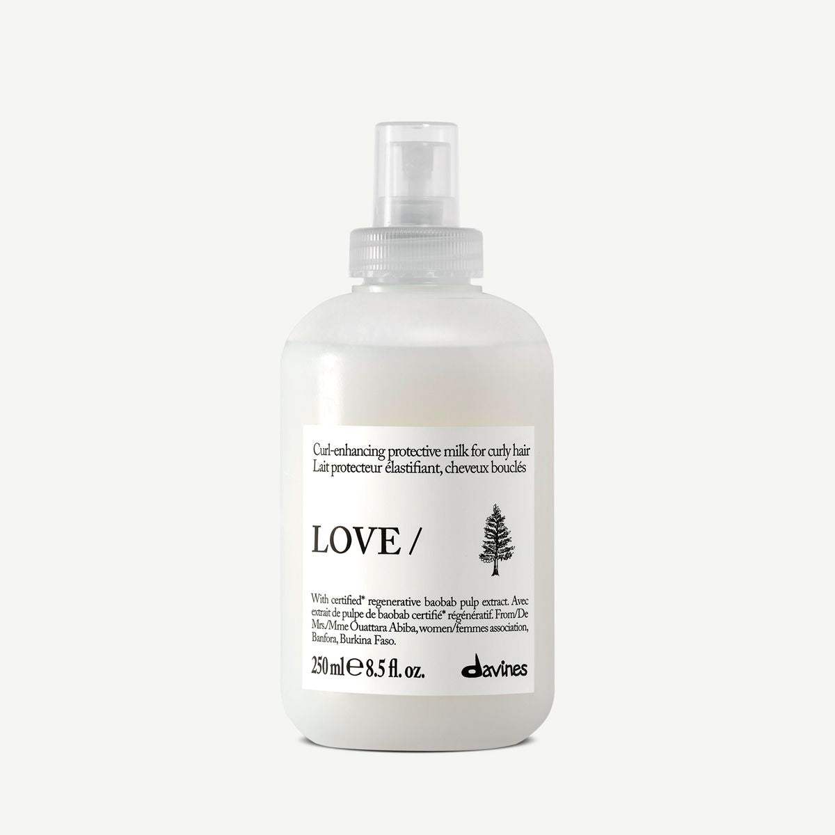 White bottle of DAVINES love curl enhancing milk for curly hair product on a white background