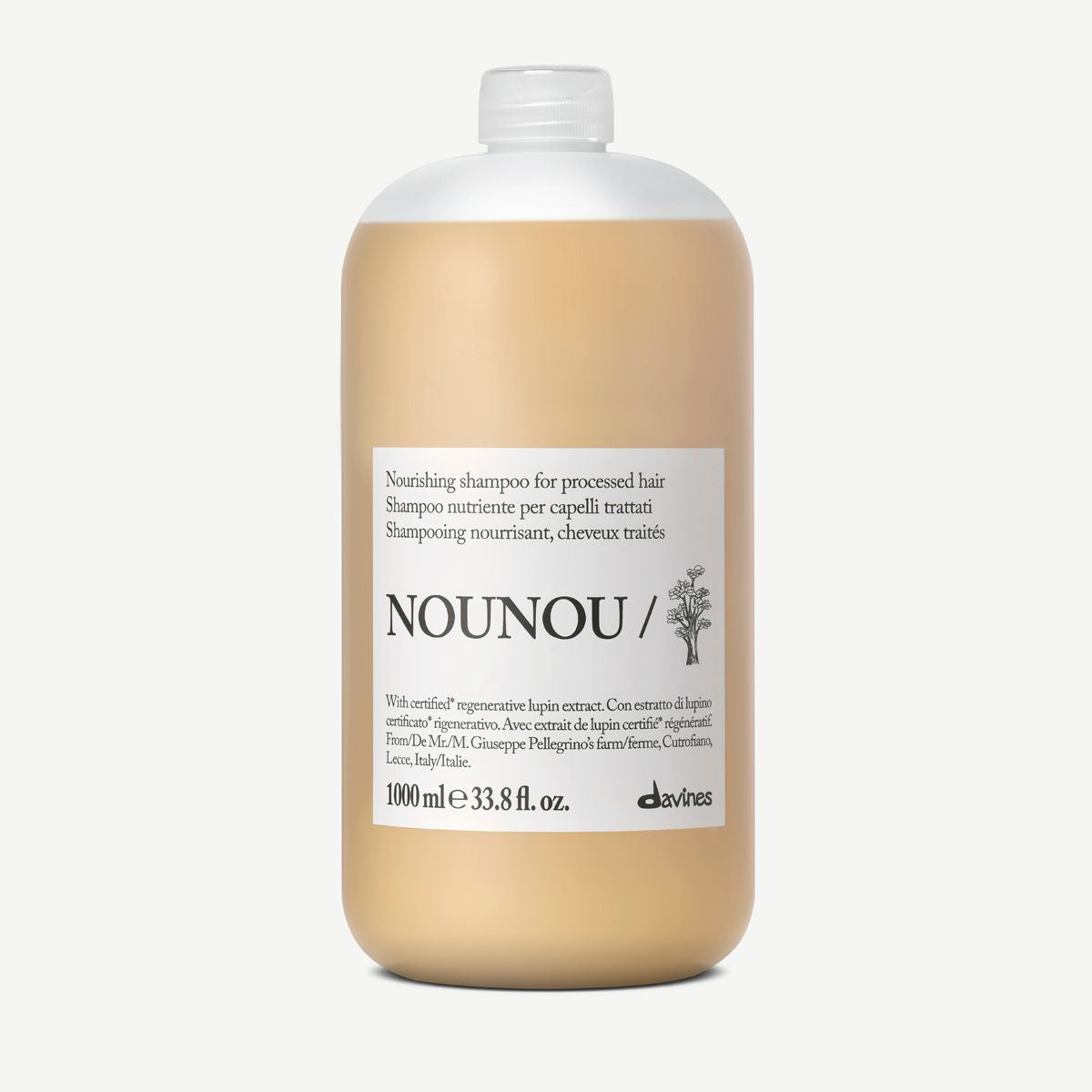A 1000 ml bottle of Nounou Nourishing Shampoo for processed hair, featuring a beige body with a white cap and a white label, set against a plain white background.