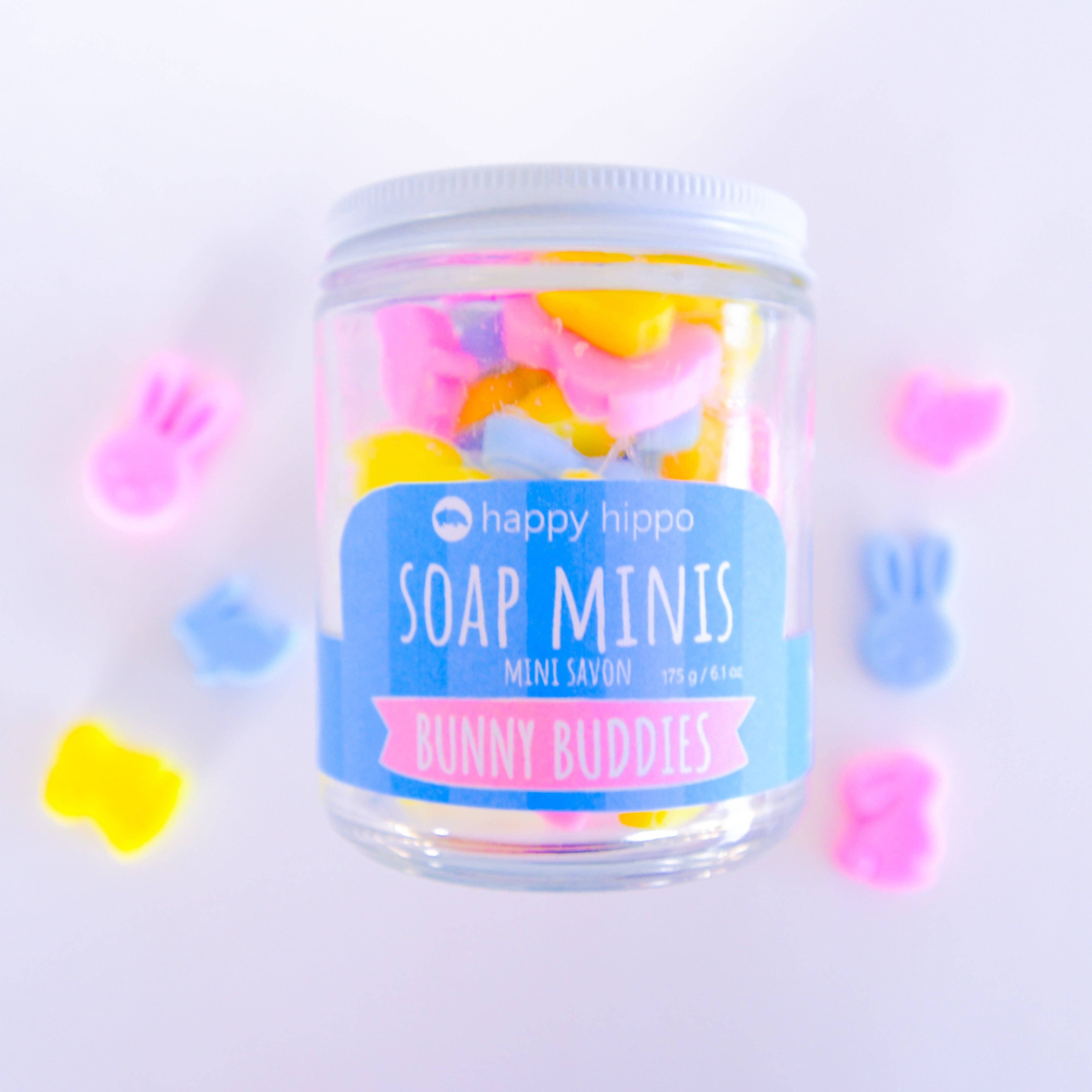 Jar of colorful Nubby soap minis with 'Happy Hippo' branding on a light purple background
