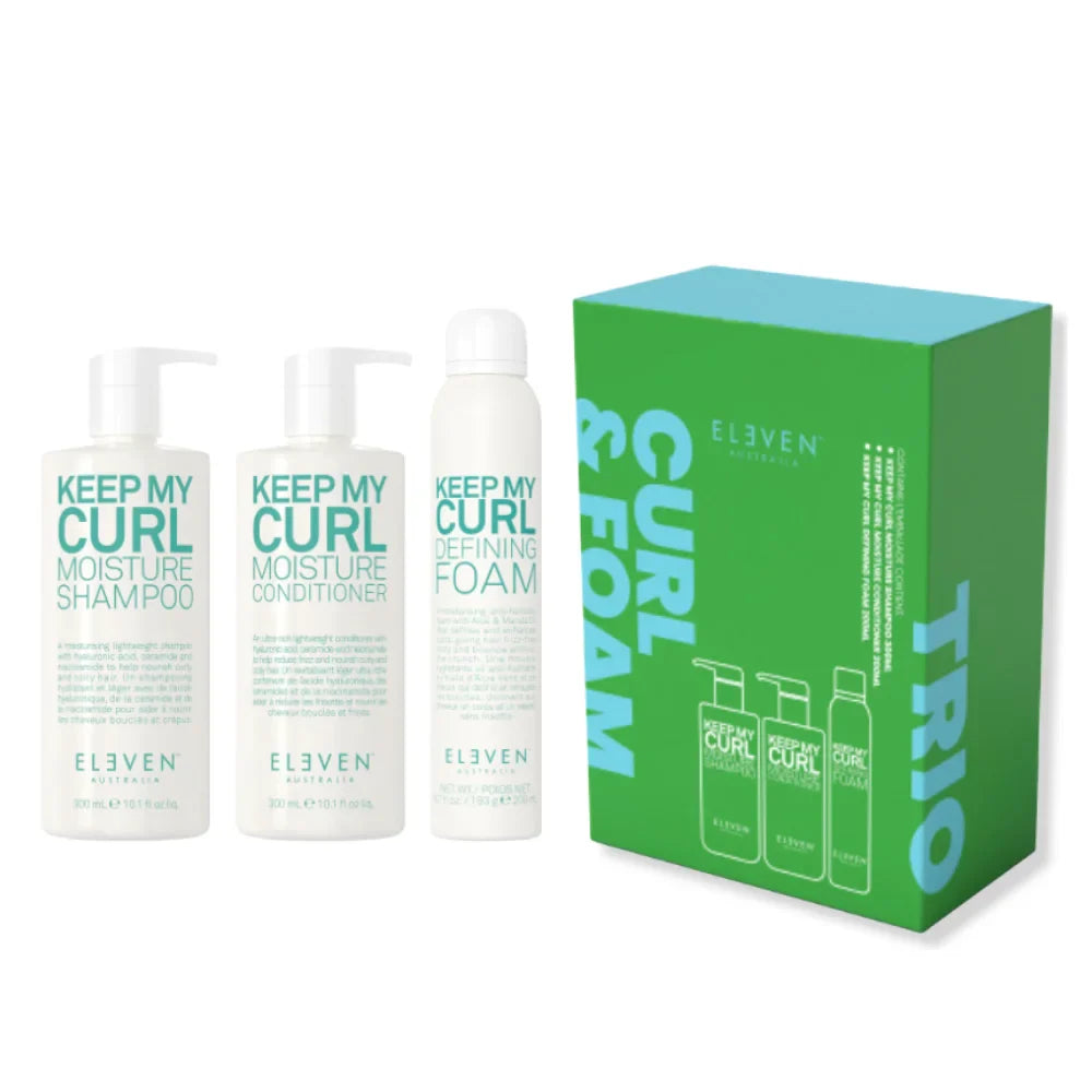 Set of 'Keep My Curl' products including shampoo, conditioner, and foam with a green box labeled 'Trio' on a white background.