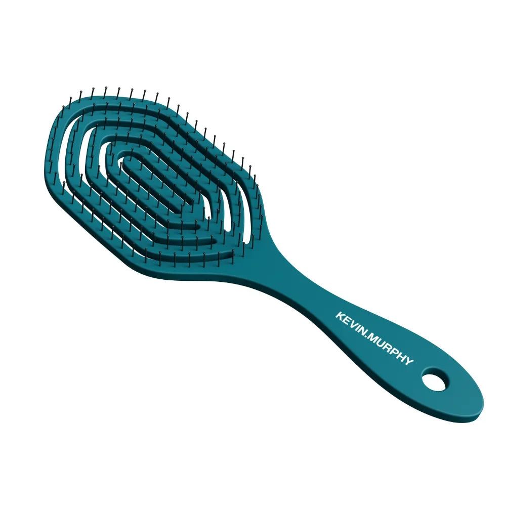 Teal hairbrush with 'KEVIN.MURPHY' branding on a white background