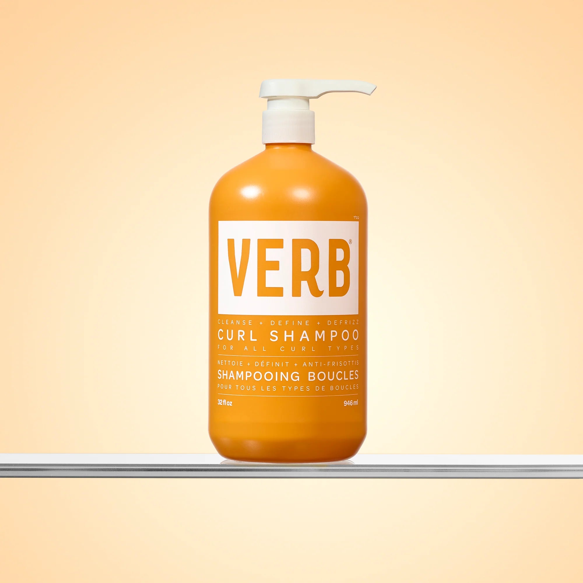Verb Curl Shampoo bottle on a beige background