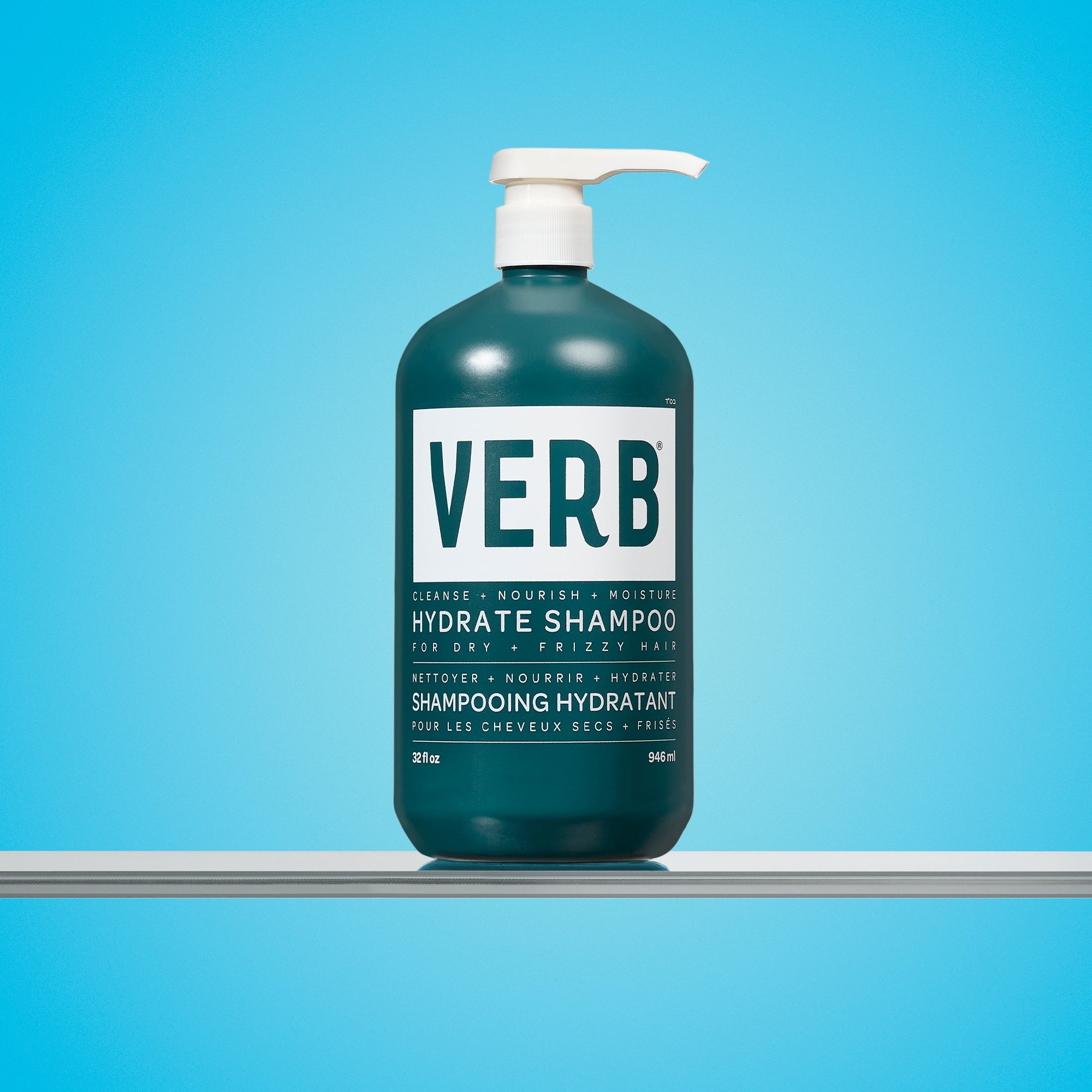 Green shampoo bottle with pump labeled 'VERB' Hydrate Shampoo Litre on a blue background