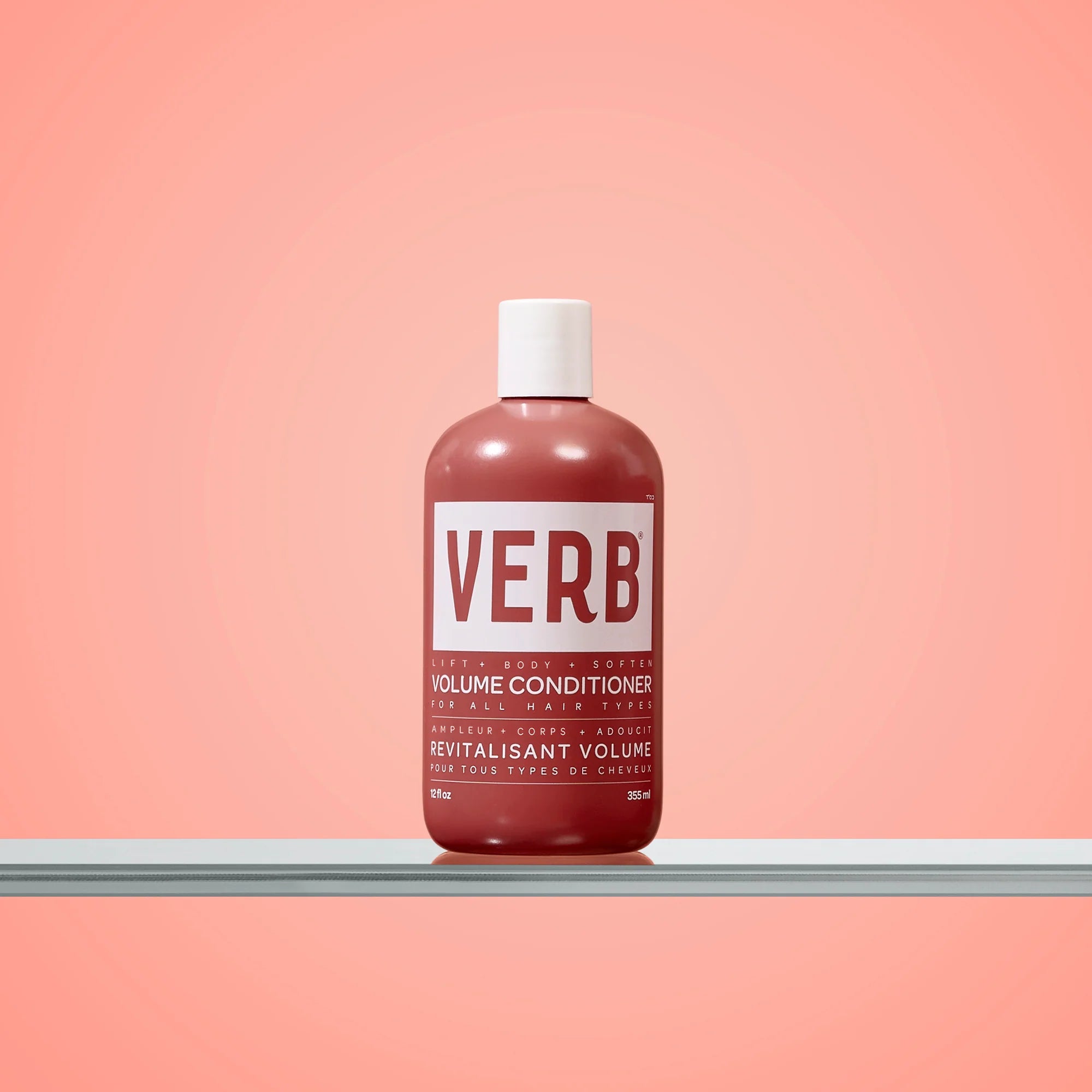 Verb volume conditioner bottle on a pink background