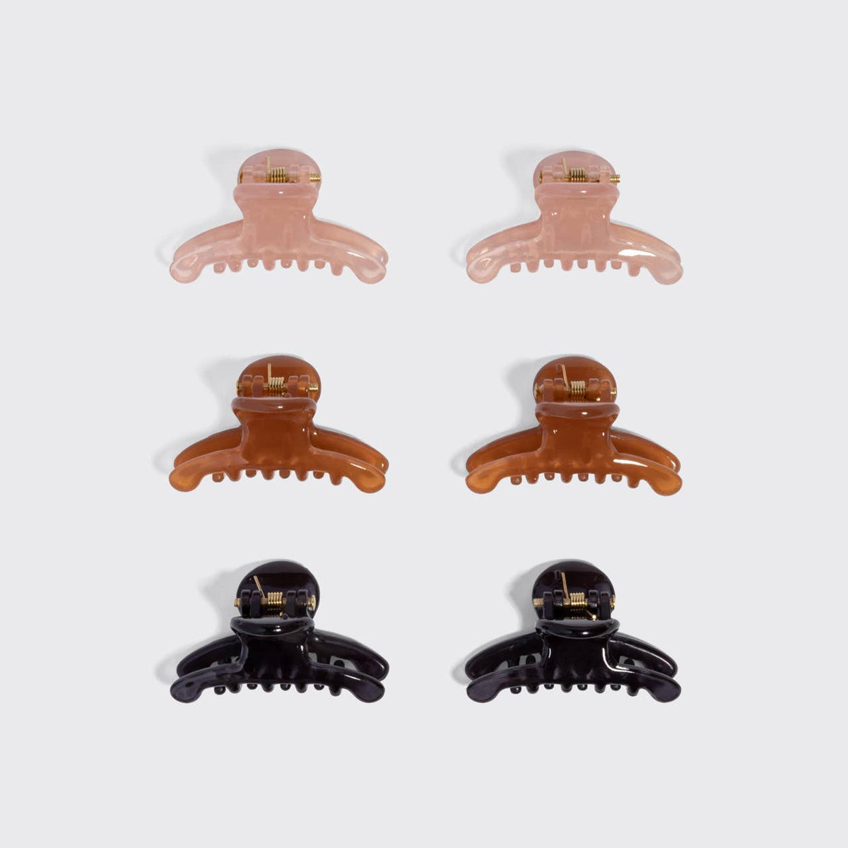 Kitsch Arched Clips set of 8 all-day hold hair clips in assorted colors. Pink, brown and black