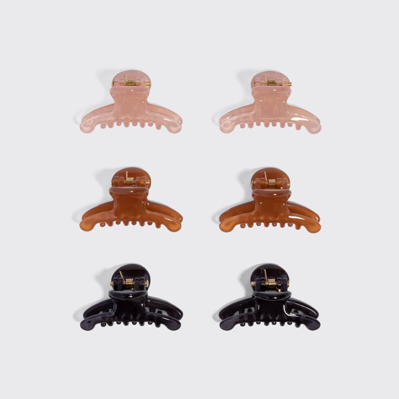 Kitsch Arched Clips set of 8 all-day hold hair clips in assorted colors. Pink, brown and black
