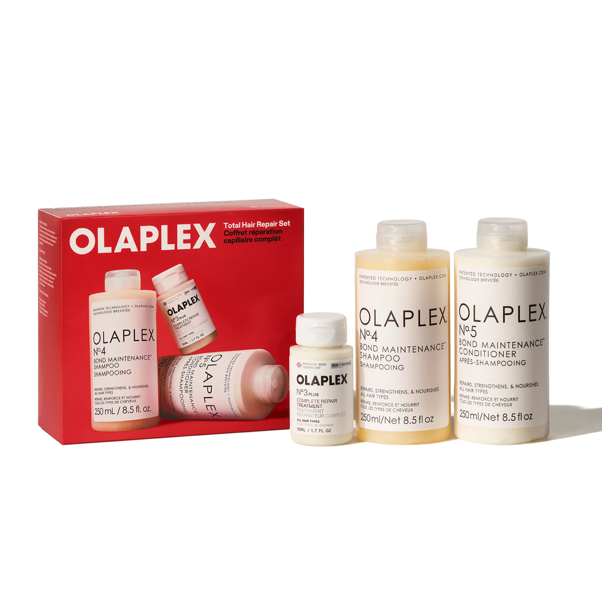 Olaplex Total Hair Repair Holiday Set including a red box and four bottles of hair care products on a white background.