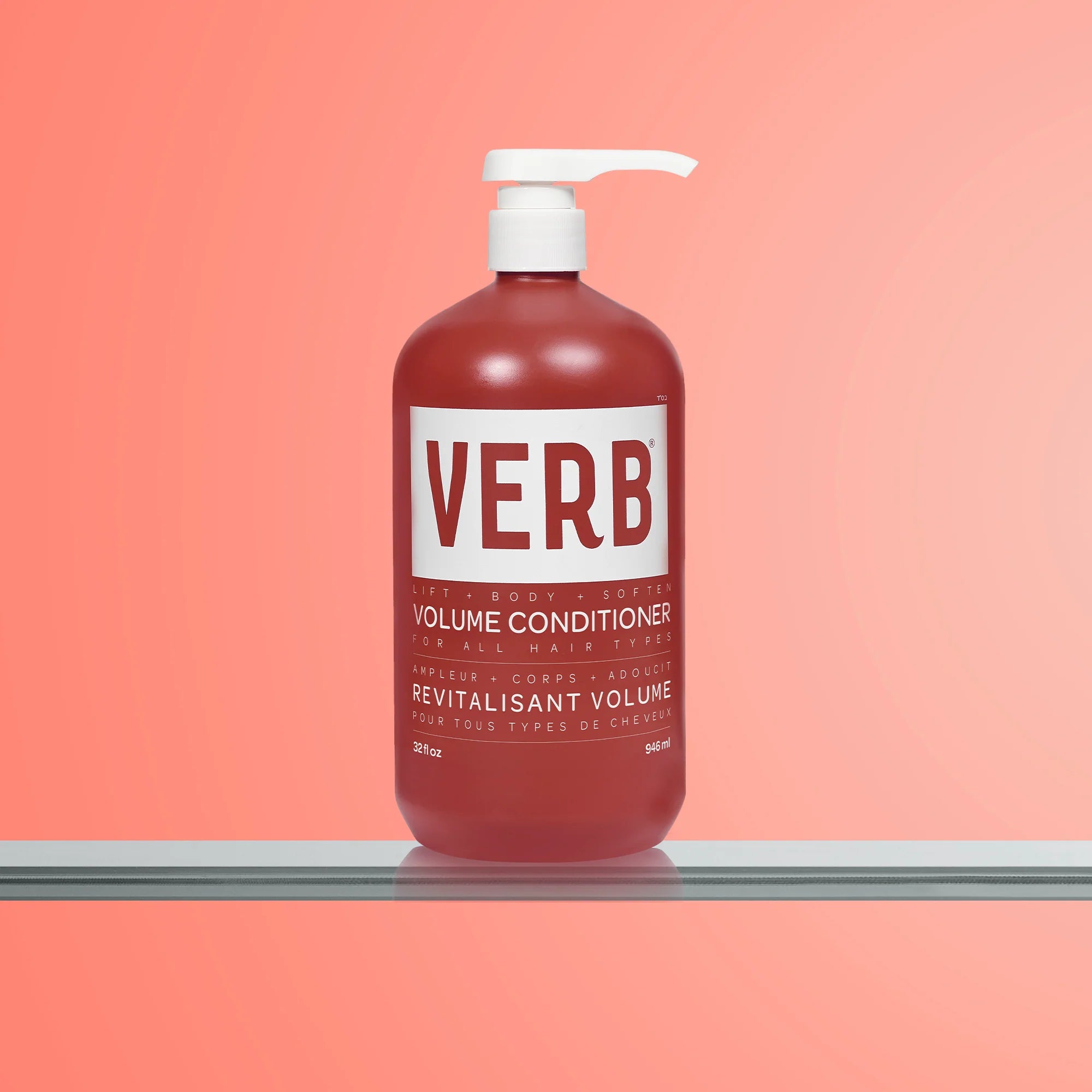 Verb volume conditioner bottle on a peach background